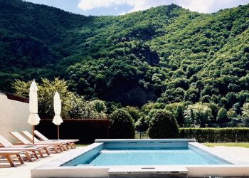 Pool and view at the wonderful guesthouse. Courtesy of Booking.com