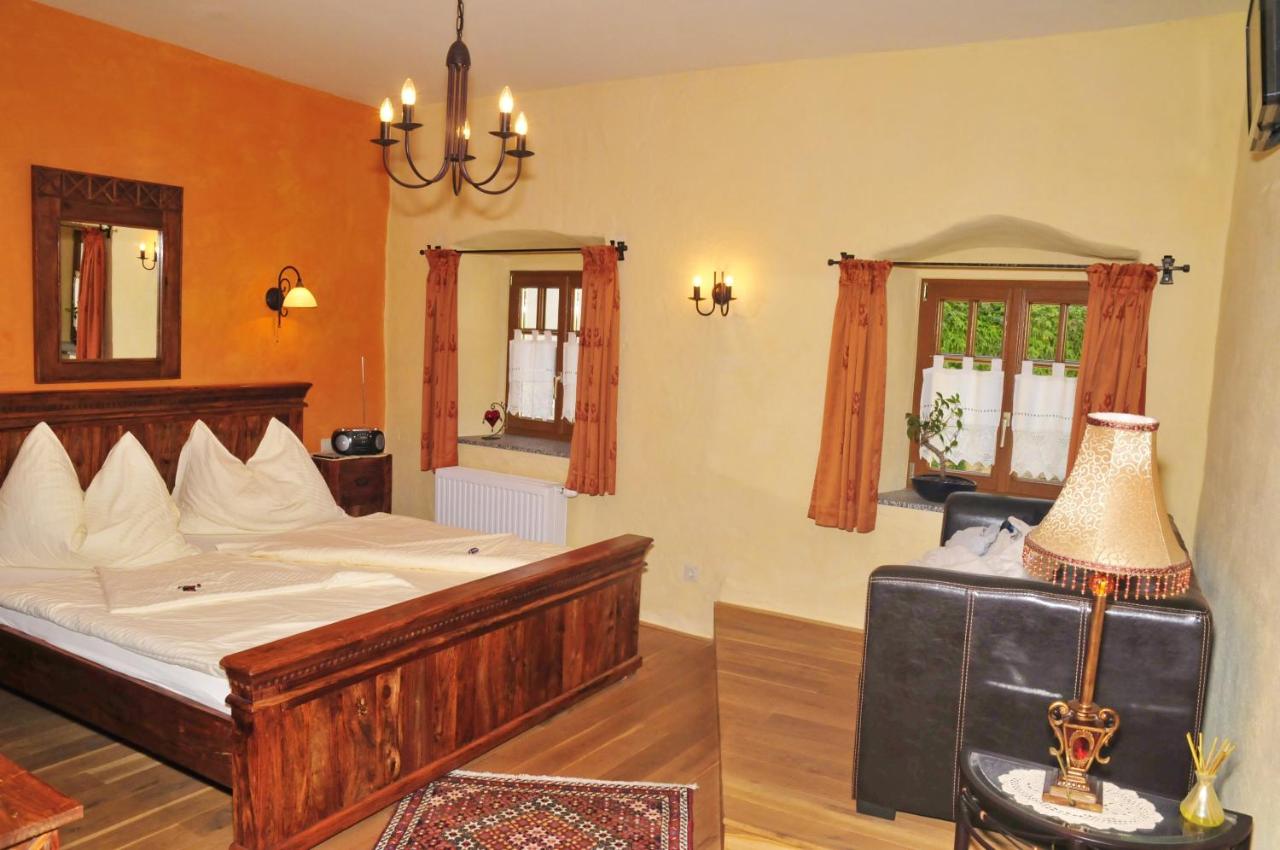 A rustic room in the guesthouse in the historic tower. Courtesy of Booking.com