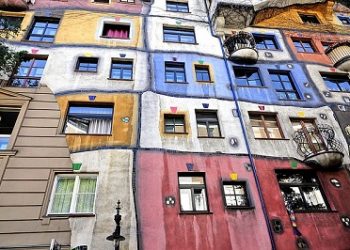 A photo of the Hundertwasserhaus, a building that is a work of art by Hundertwasser
