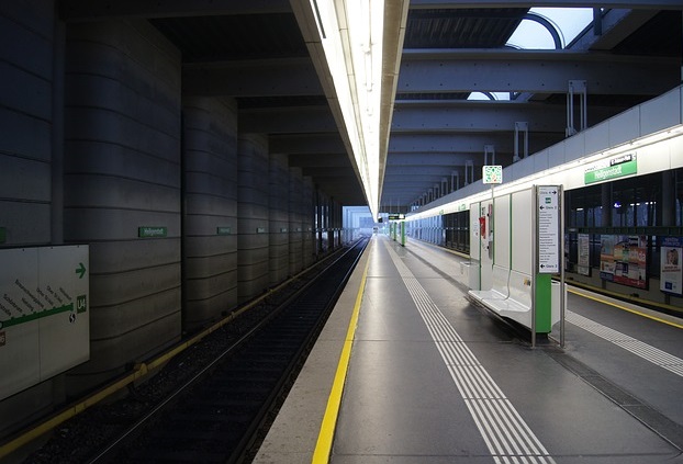 Subway platform. Note the large signage on the left. Each platform is beautifully controlled