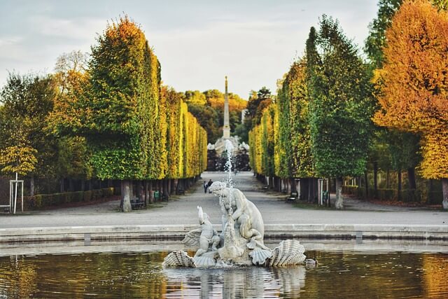 The gardens of Schönbrunn Palace in autumn. The trees are changing color