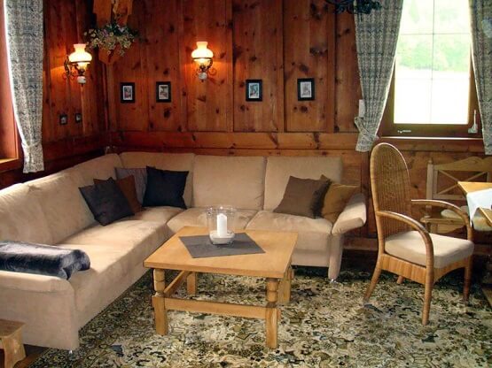 A warm and rustic living room in the Kreuzhof apartment building