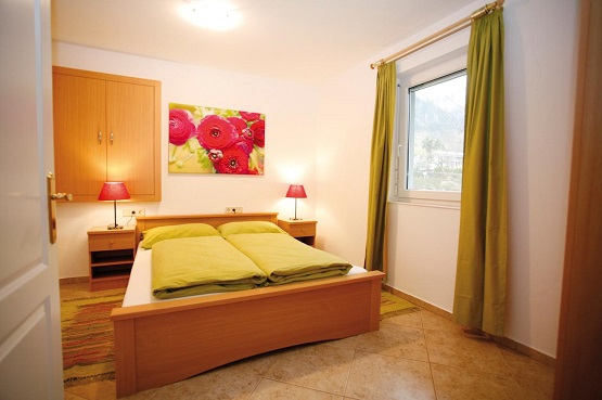 A cozy bedroom in the Appartements am See