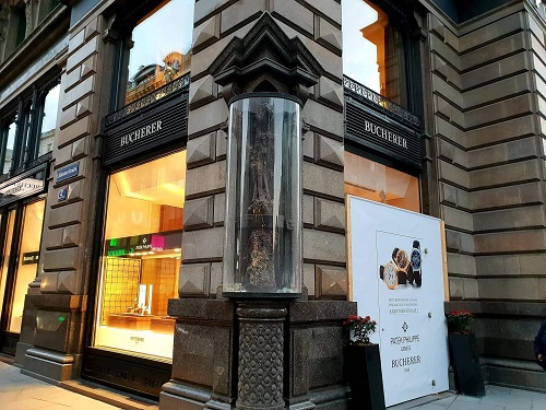 The Stock im Eisen (Trunk in Iron) encased in glass on a street corner